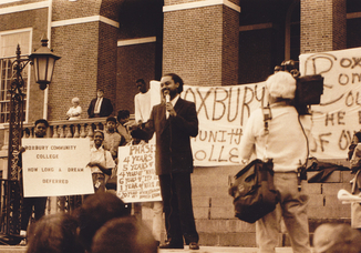 REPRESENTATIVE BYRON RUSHING SPEAKING AT THE MA COMMUNITY COLLEGE RALLY (1989)
